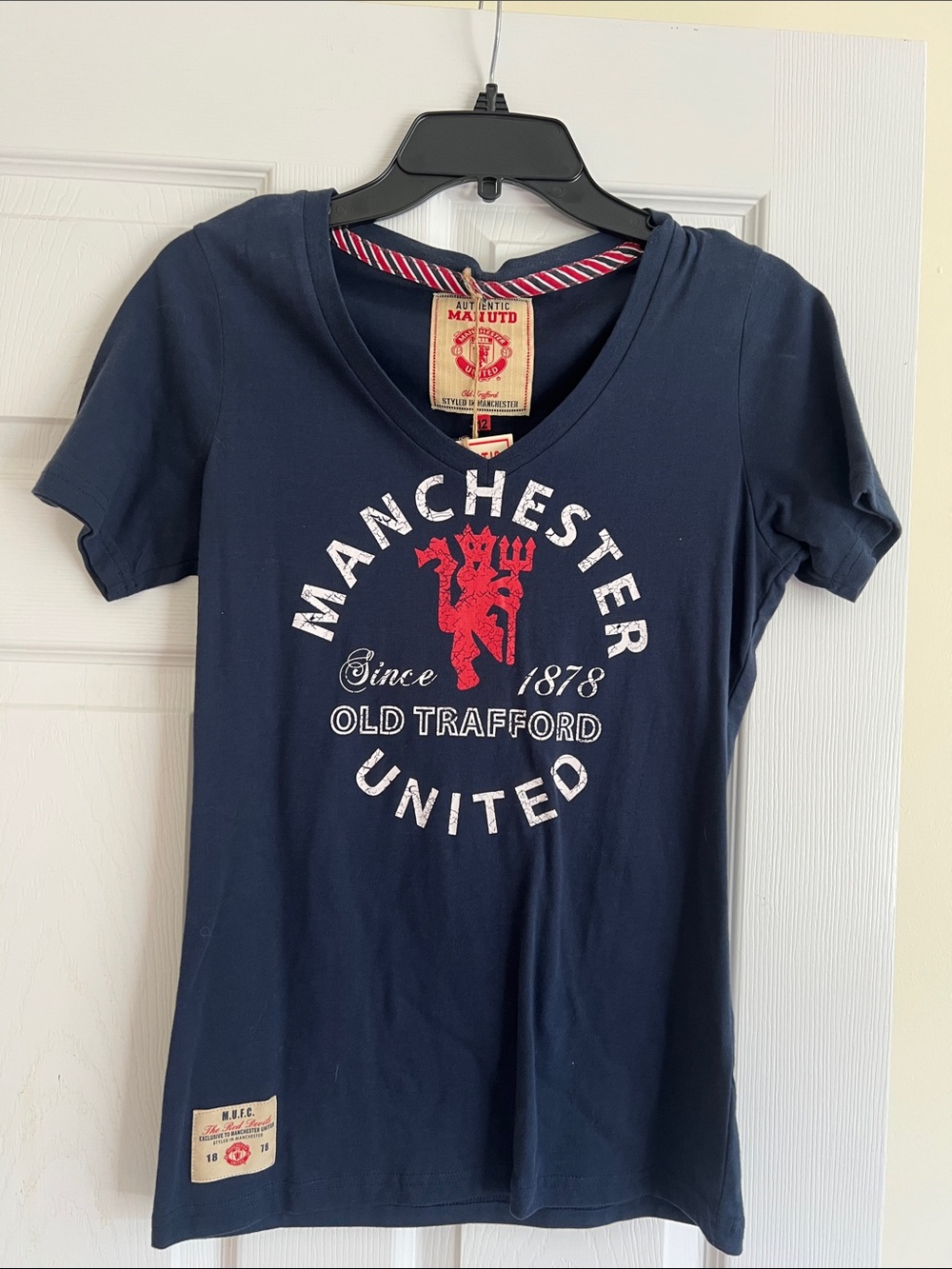 Manchester United Navy V-Neck Tee with Red Crest